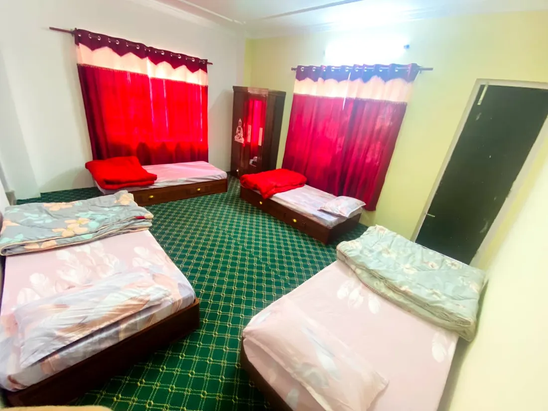 Shared room with three beds